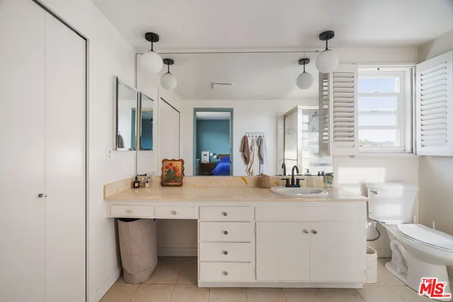 a bedroom with bed and window