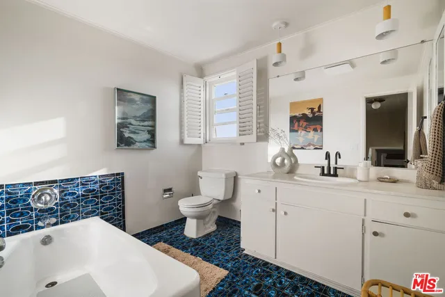 a bathroom with a sink a mirror and shower