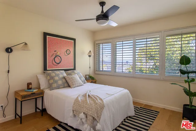 a view of a house with pool and a yard