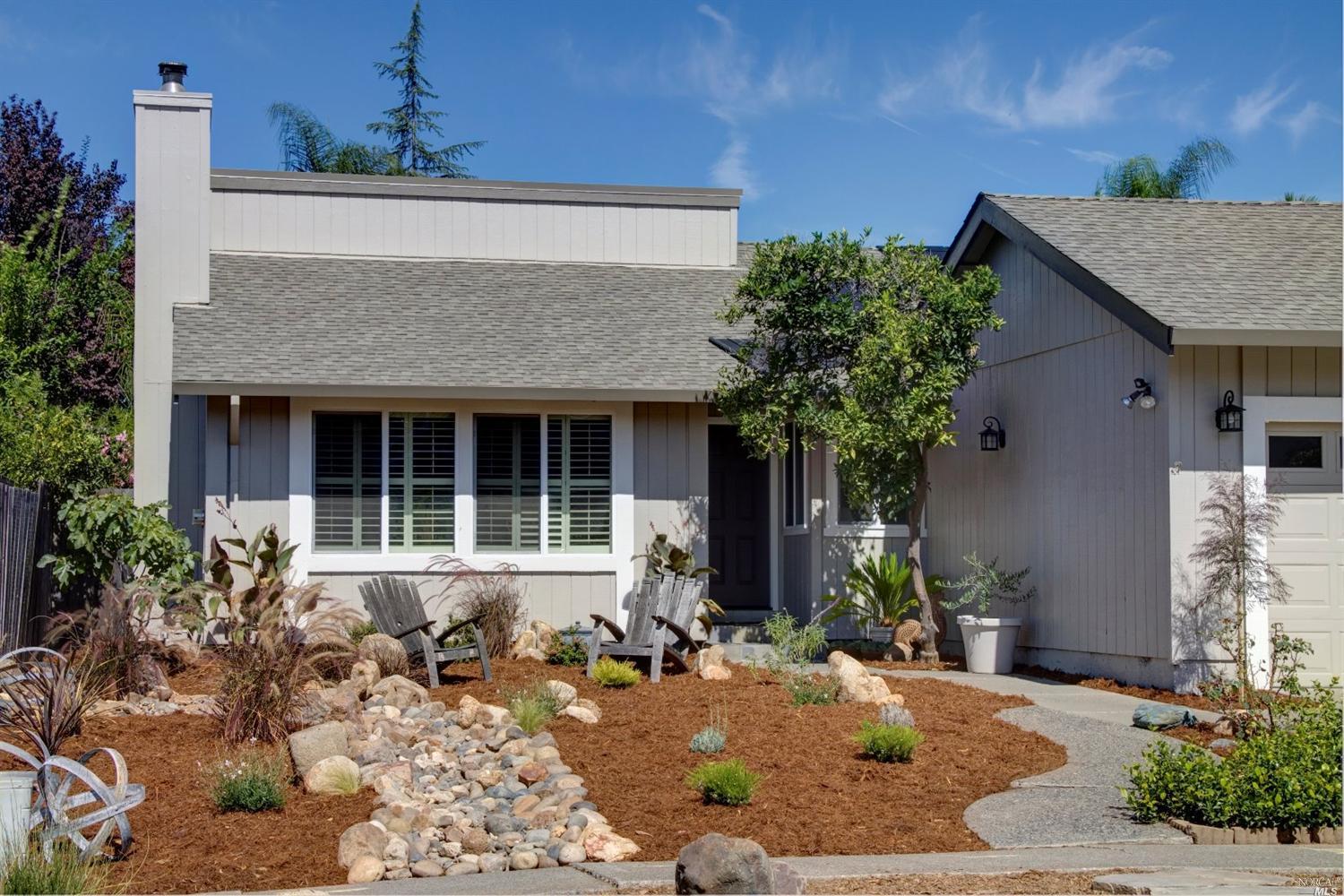 a front view of a house with garden