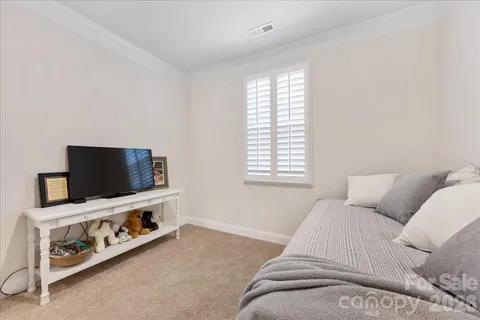 a room with a bed and a chair