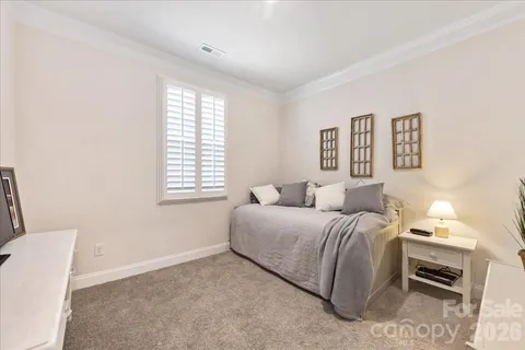 a large white kitchen with lots of counter space wooden floor and appliances