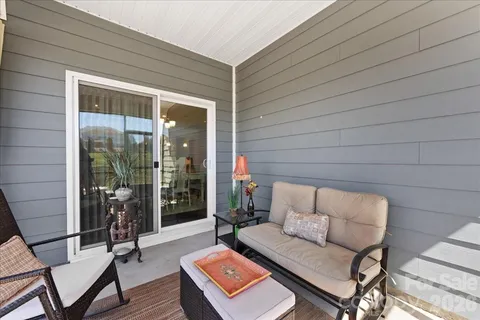 a backyard of a house with outdoor seating