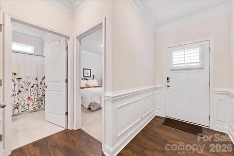 a view of bedroom with furniture and window