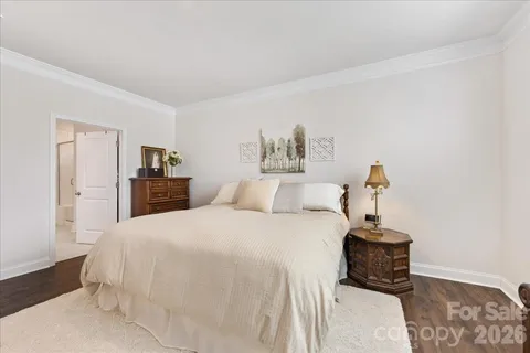 a bed room with a bed window and a flat screen tv