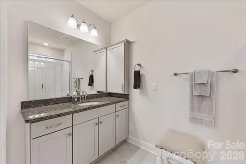 a bathroom with a shower and toilet