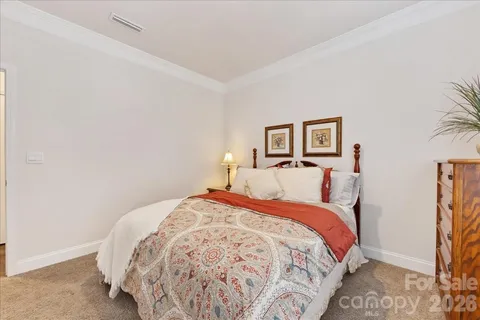 a bedroom with bed and a window