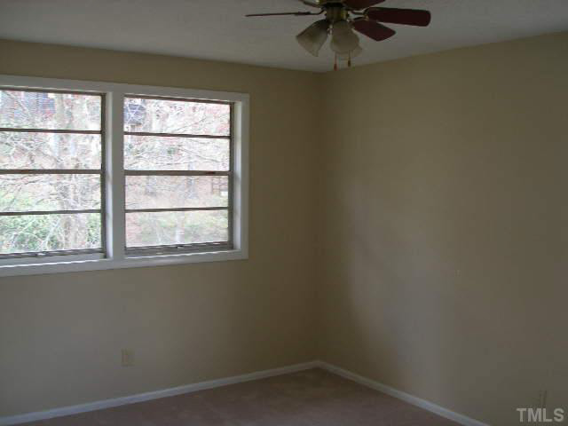 2108 Atkins Drive Raleigh, NC 27610 - Photo 8 of 11 an empty room with a window
