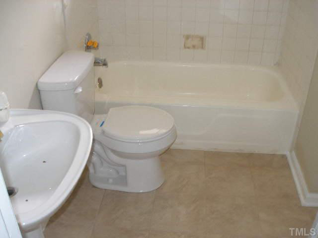 2108 Atkins Drive Raleigh, NC 27610 - Photo 10 of 11 a bathroom with a sink and a toilet