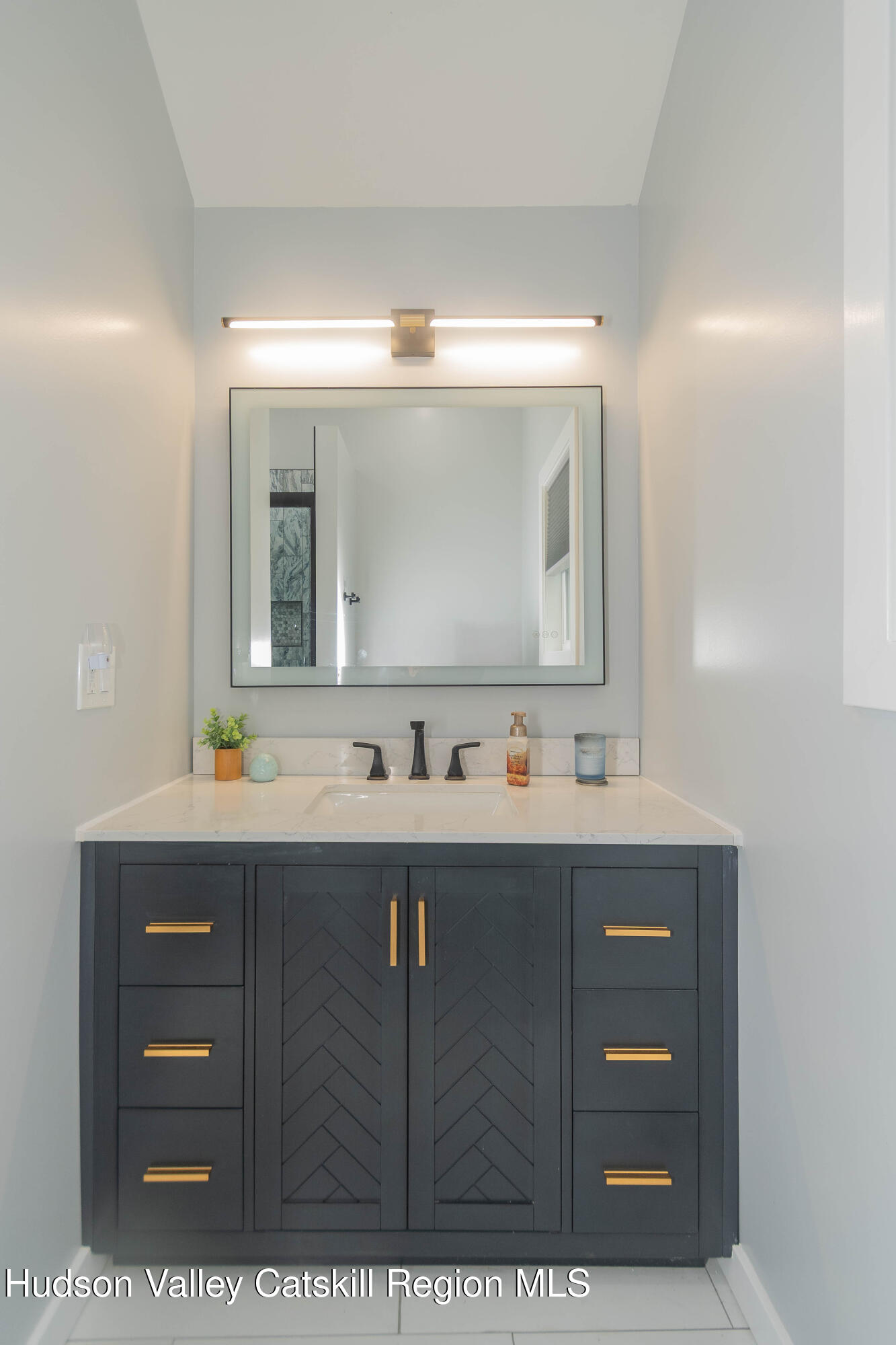 183 Mill Road Olivebridge, NY 12461 - Photo 25 of 30 a bathroom with a sink vanity and mirror