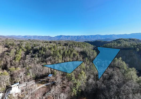 an aerial view of a house with mountain view