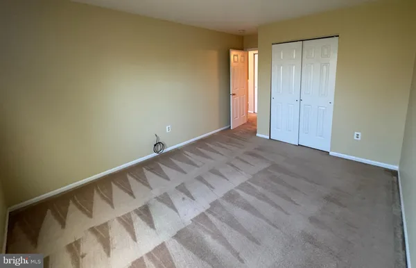 a view of a bathroom with shower and bathtub