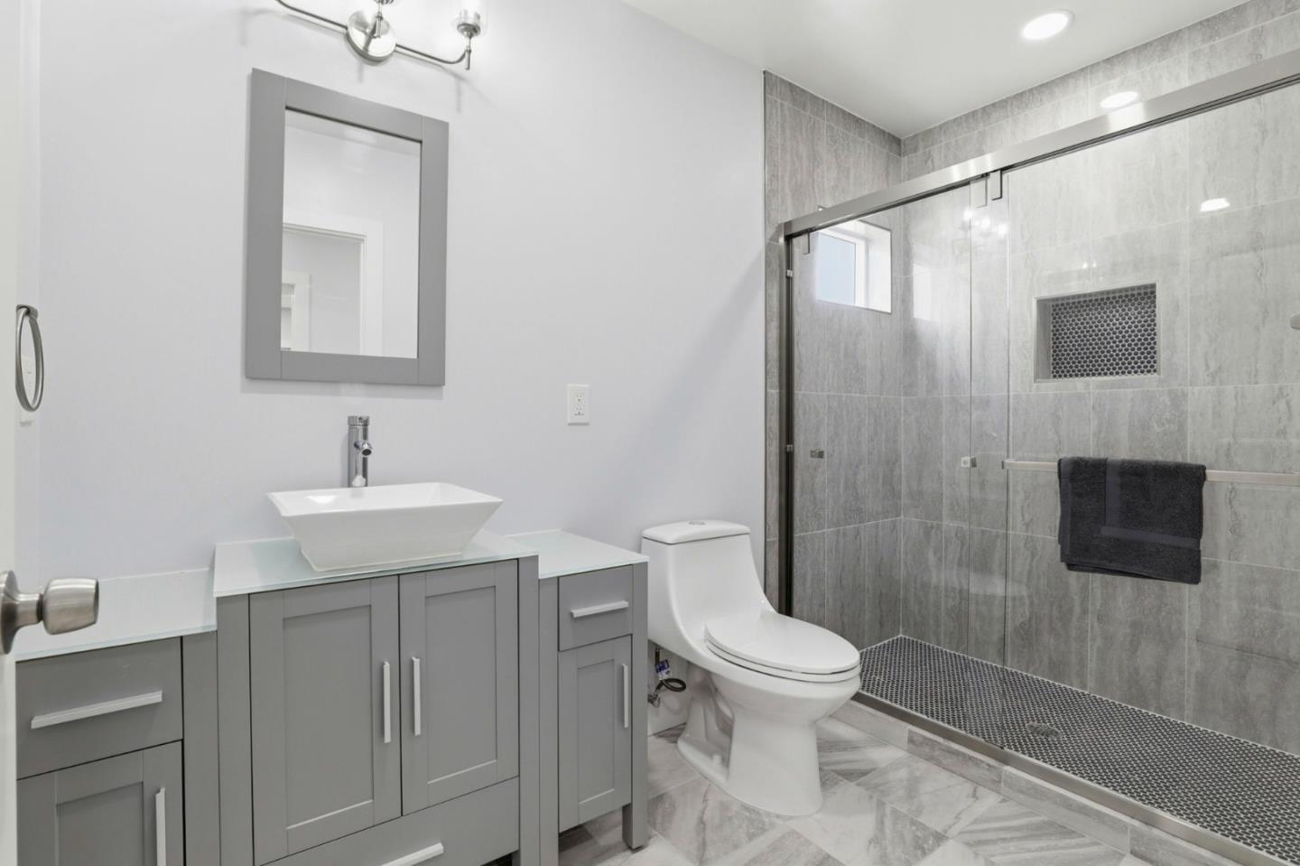 1802 Ponca Court Fremont, CA 94539 - Photo 19 of 28 a bathroom with a toilet a sink and mirror