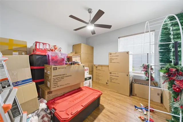a room with furniture and a fan