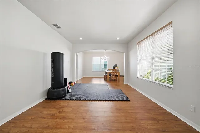 a living room with furniture rug and window