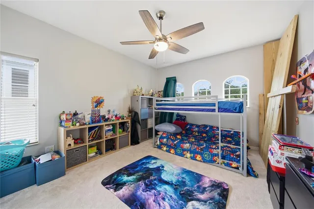 a bed room with a bed and a window