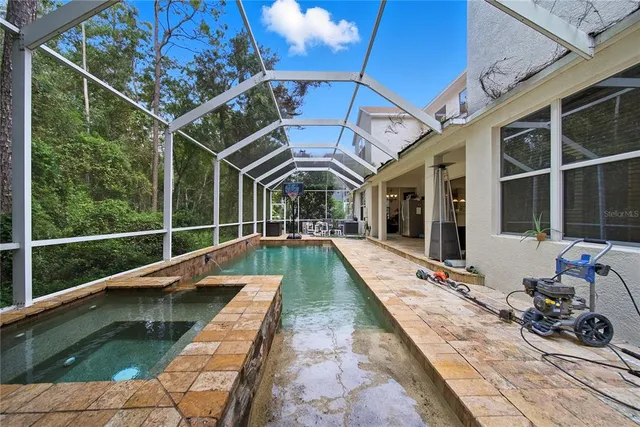 a view of swimming pool with lounge chair
