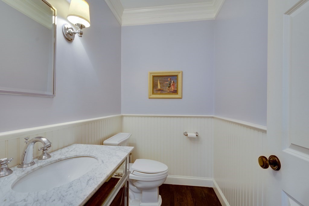 24 Fletcher Road Needham, MA 02492 - Photo 14 of 29 a bathroom with a granite countertop sink a toilet and a mirror