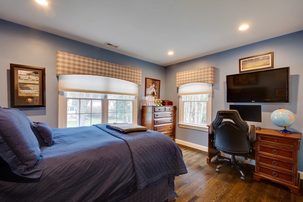 24 Fletcher Road Needham, MA 02492 - Photo 16 of 29 a bedroom with a bed and tv