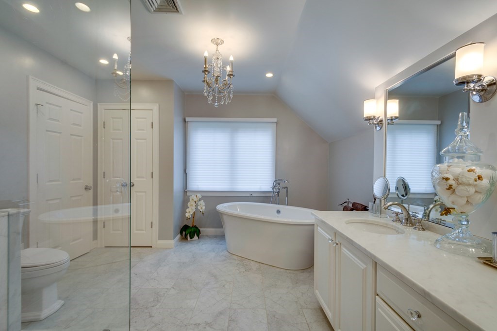 24 Fletcher Road Needham, MA 02492 - Photo 23 of 29 a spacious bathroom with a double vanity sink toilet mirror and bathtub
