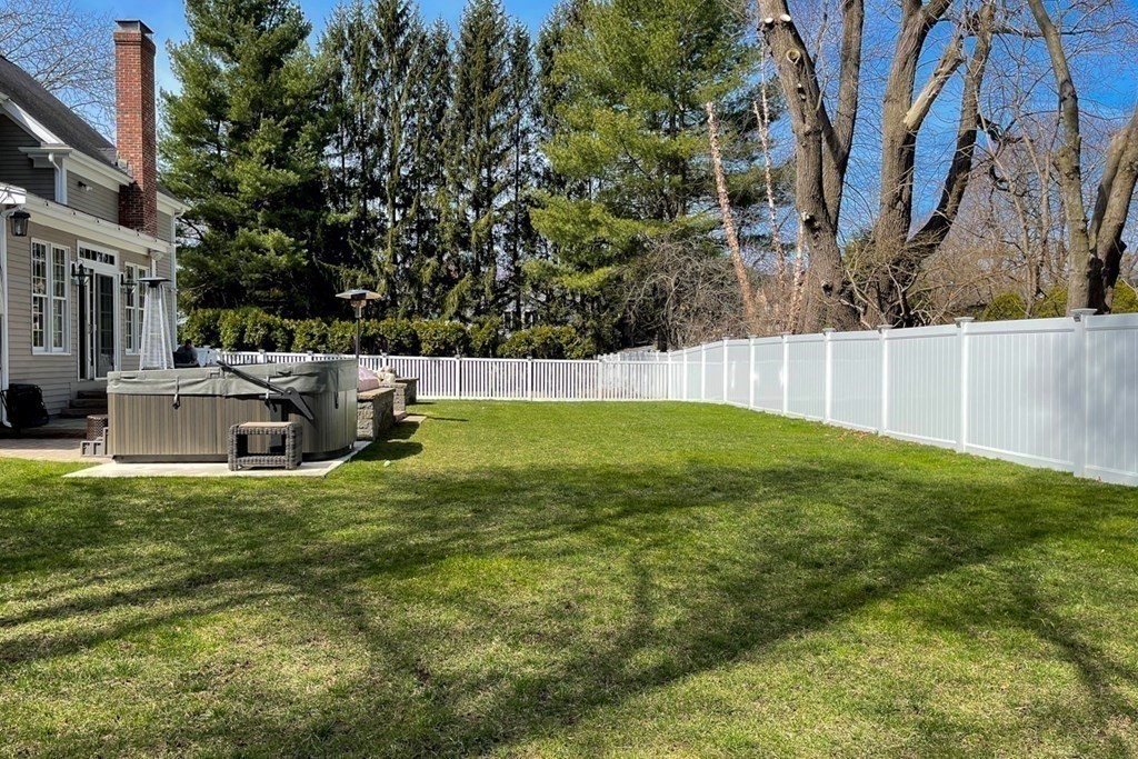 24 Fletcher Road Needham, MA 02492 - Photo 28 of 29 a view of a house with a yard and sitting area