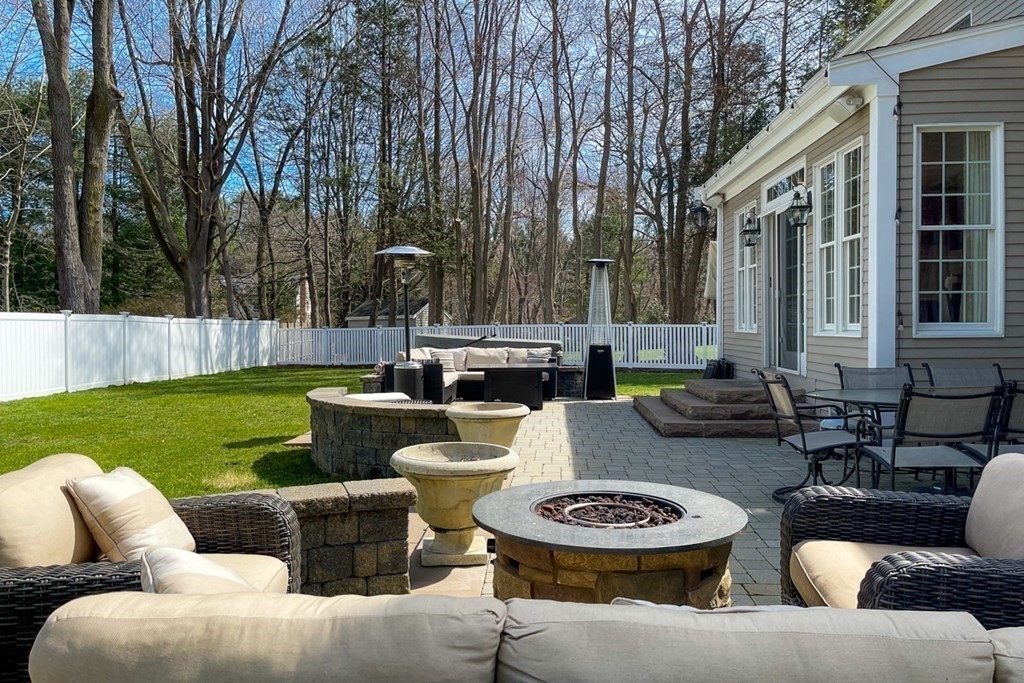 24 Fletcher Road Needham, MA 02492 - Photo 29 of 29 a view of a patio with couches chairs and a fire pit