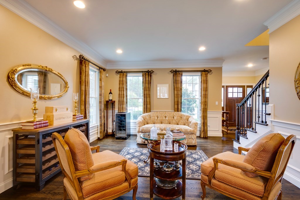 24 Fletcher Road Needham, MA 02492 - Photo 5 of 29 a living room with furniture a fireplace and a large window