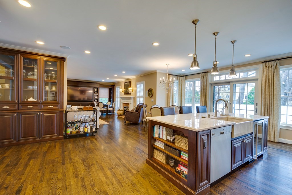 24 Fletcher Road Needham, MA 02492 - Photo 8 of 29 a kitchen with stainless steel appliances granite countertop a sink a stove and a wooden floors