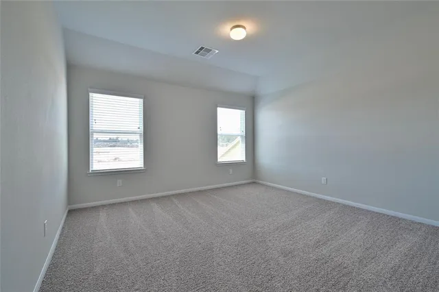 an empty room that has a window