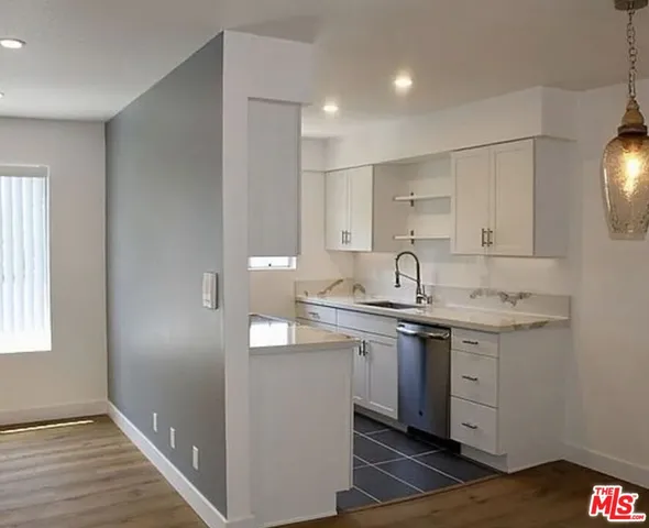 a kitchen with a sink and cabinets