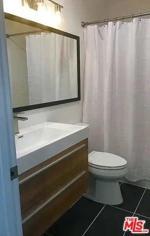 a bathroom with a sink and a toilet