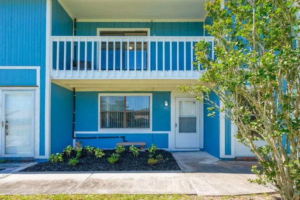 a view of a house with a small yard