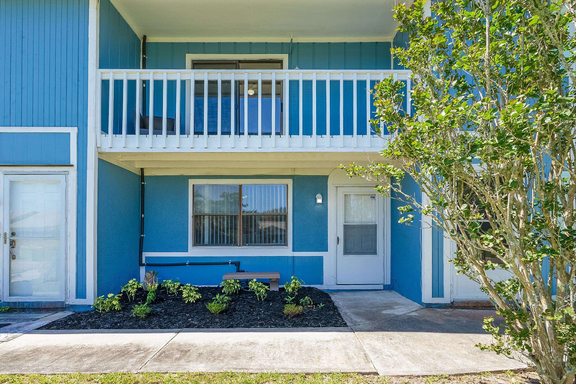 123 Rio Del Mar Street, Unit B St. Augustine, FL 32080 - Photo 12 of 51 a view of a house with a small yard