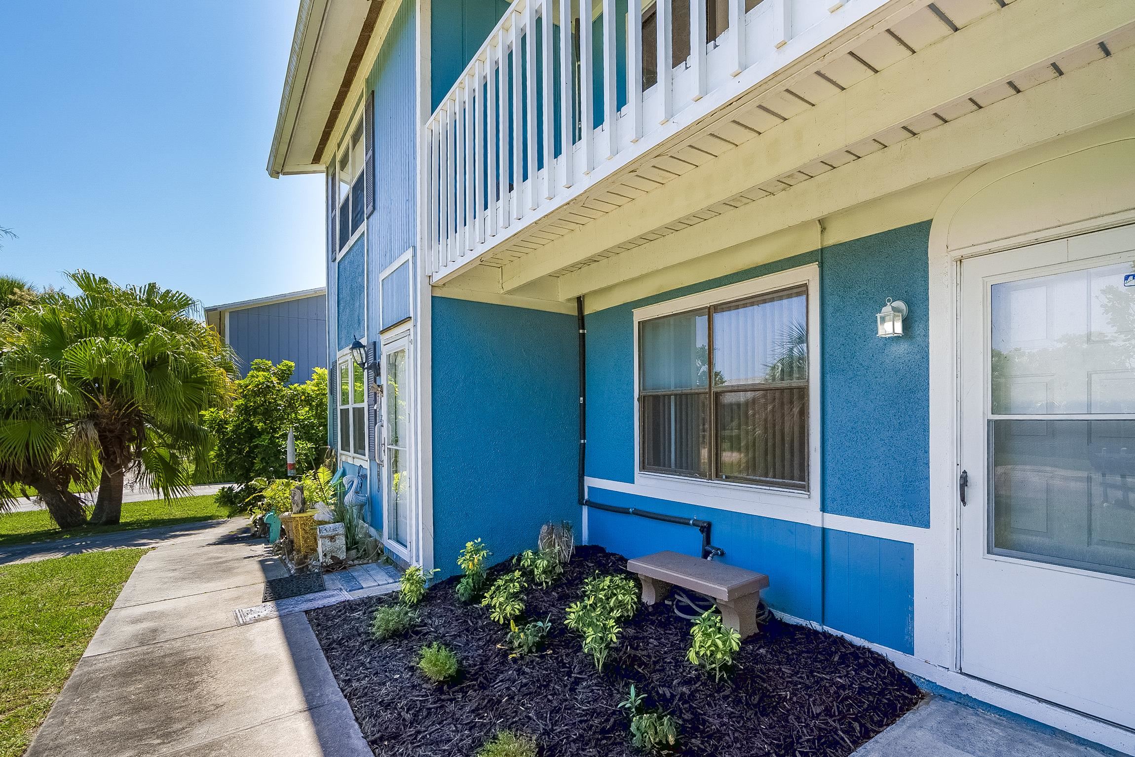 123 Rio Del Mar Street, Unit B St. Augustine, FL 32080 - Photo 13 of 51 a view of a house with a yard