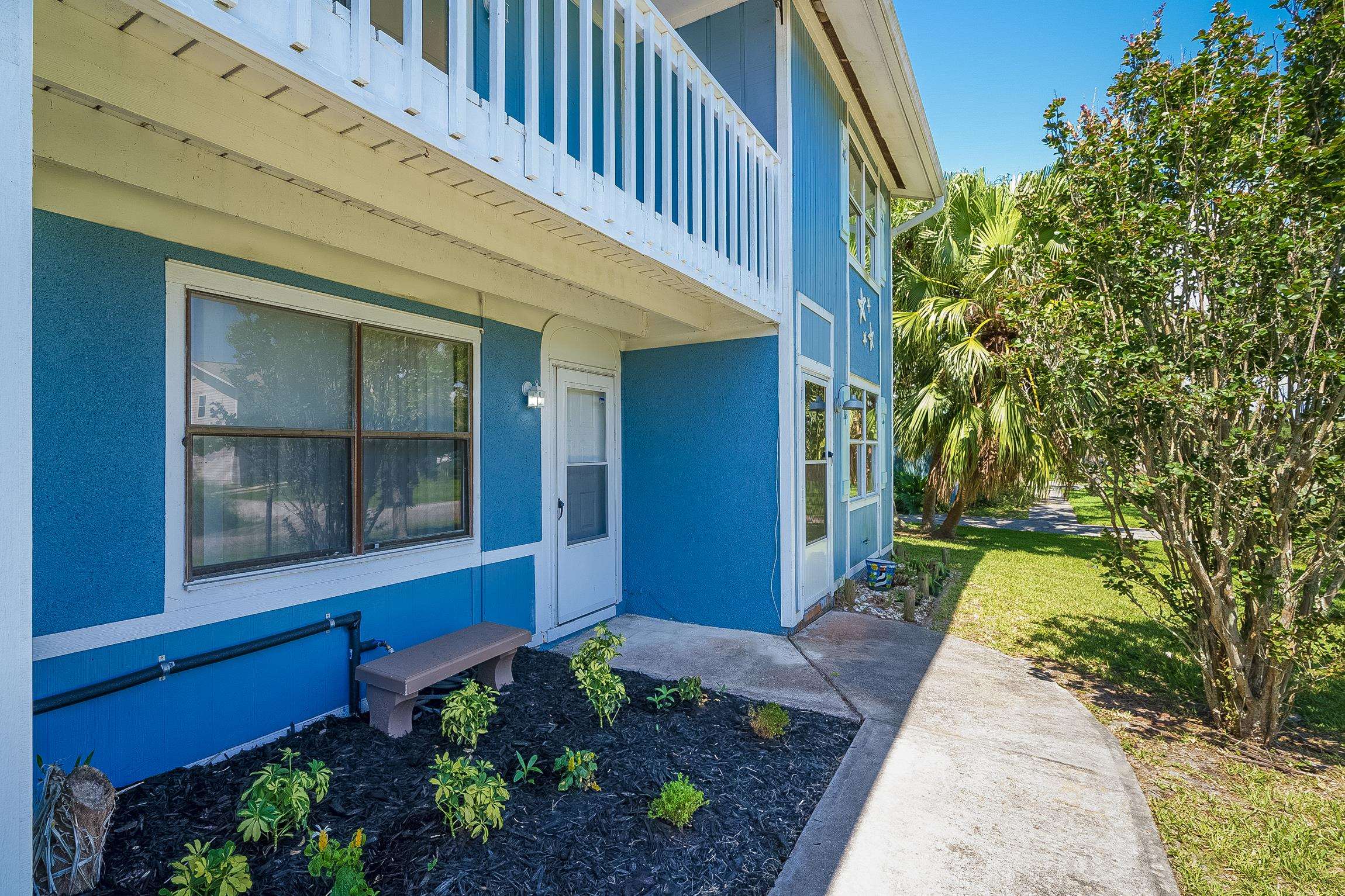 123 Rio Del Mar Street, Unit B St. Augustine, FL 32080 - Photo 14 of 51 a view of a house with a backyard