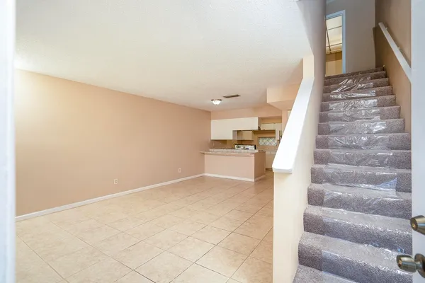 a view of entryway and kitchen