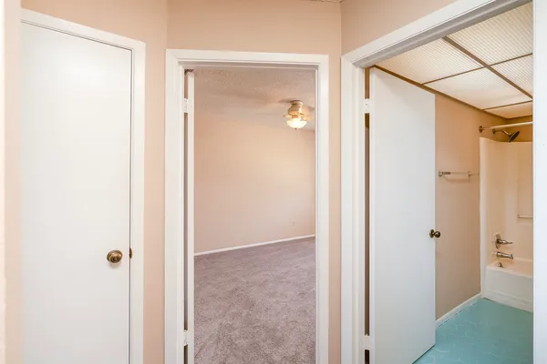 a view of a bathroom with a glass door