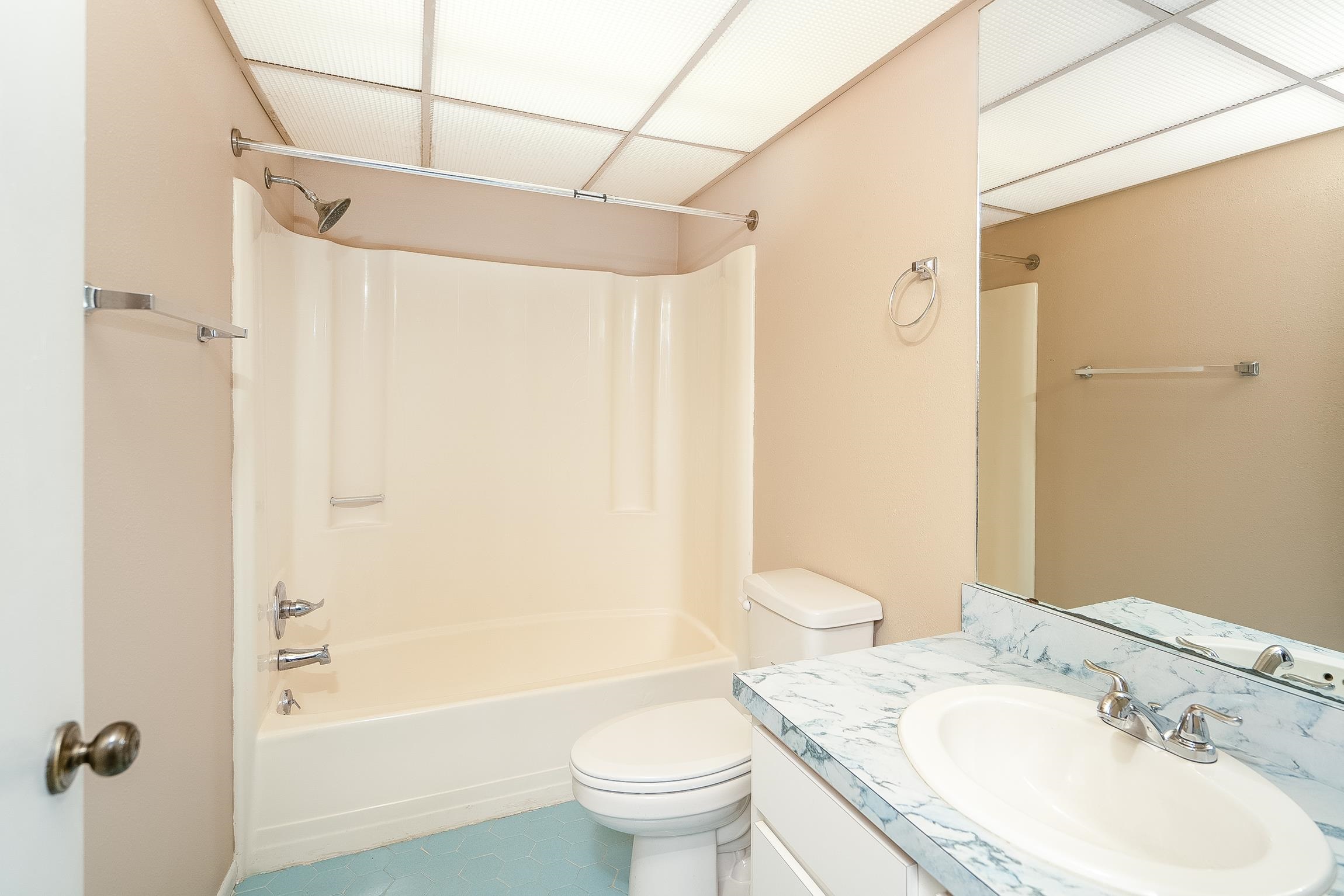 123 Rio Del Mar Street, Unit B St. Augustine, FL 32080 - Photo 29 of 51 a bathroom with a sink toilet and shower