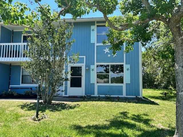 123 Rio Del Mar Street, Unit B St. Augustine, FL 32080 - Photo 3 of 51 front view of house with a yard