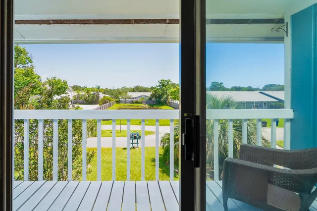 a view of a balcony with chair