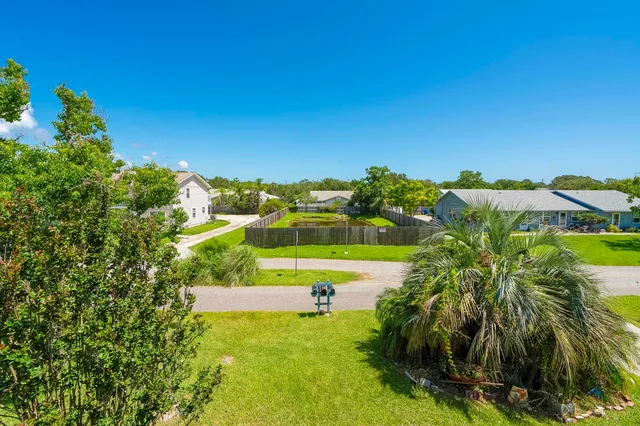 a view of a swimming pool with a yard