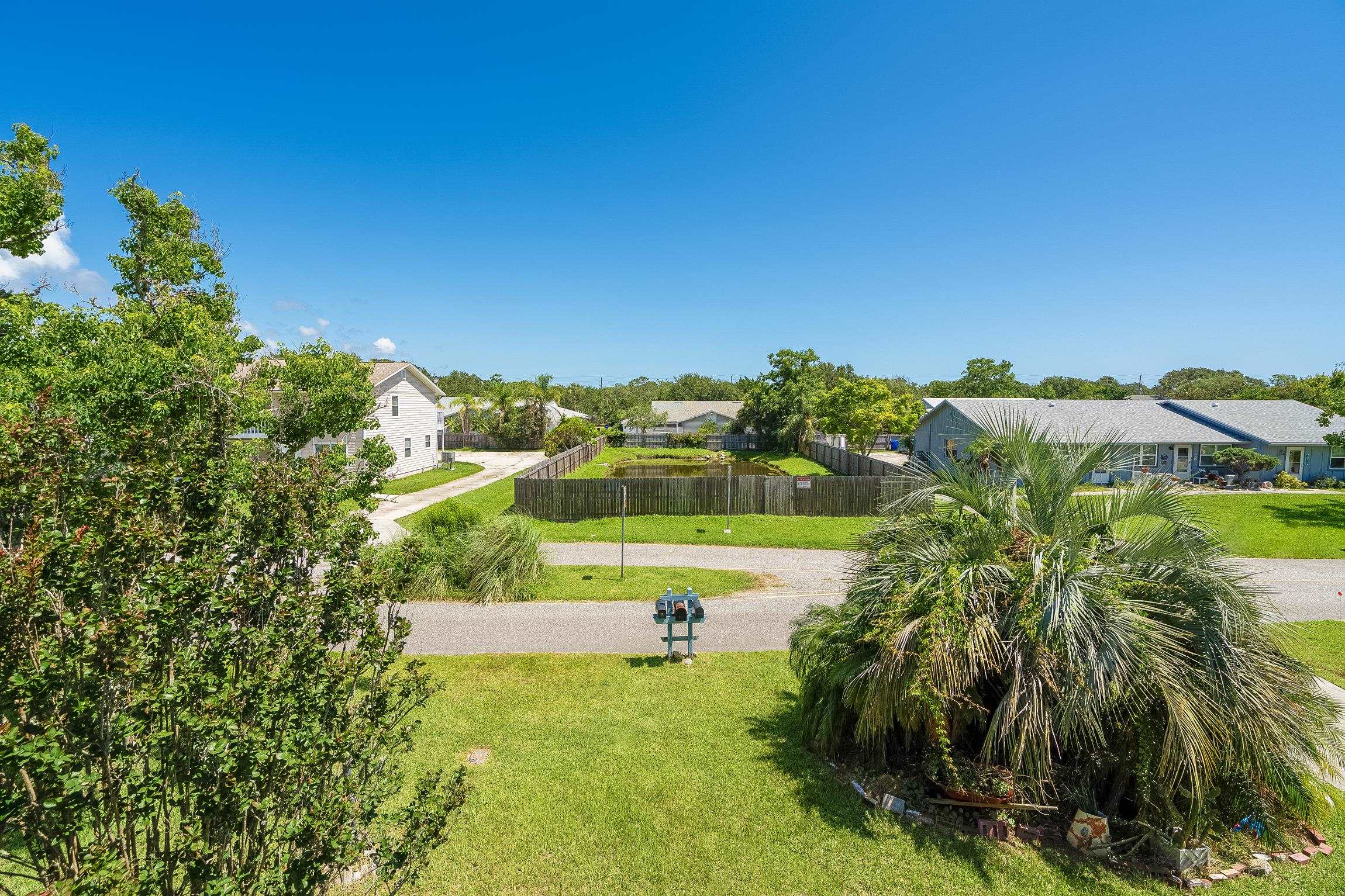 123 Rio Del Mar Street, Unit B St. Augustine, FL 32080 - Photo 38 of 51 a view of a swimming pool with a yard