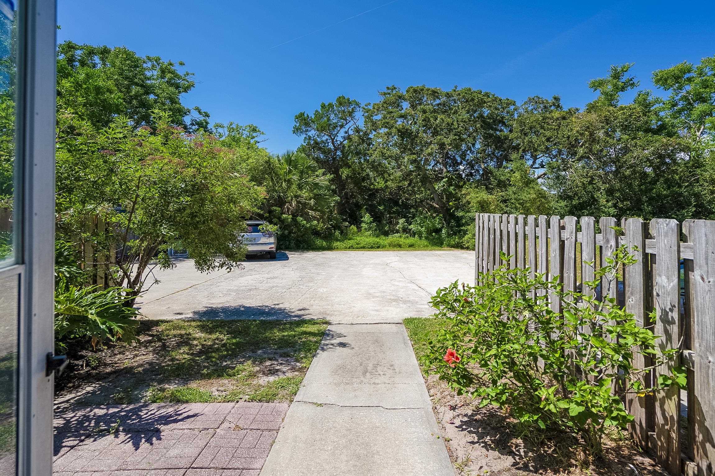 123 Rio Del Mar Street, Unit B St. Augustine, FL 32080 - Photo 39 of 51 a view of a garden with pathway