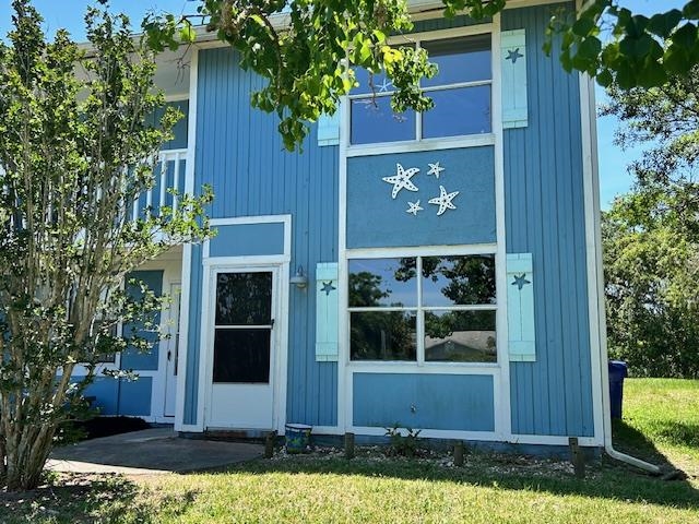 123 Rio Del Mar Street, Unit B St. Augustine, FL 32080 - Photo 4 of 51 a front view of a house with garden