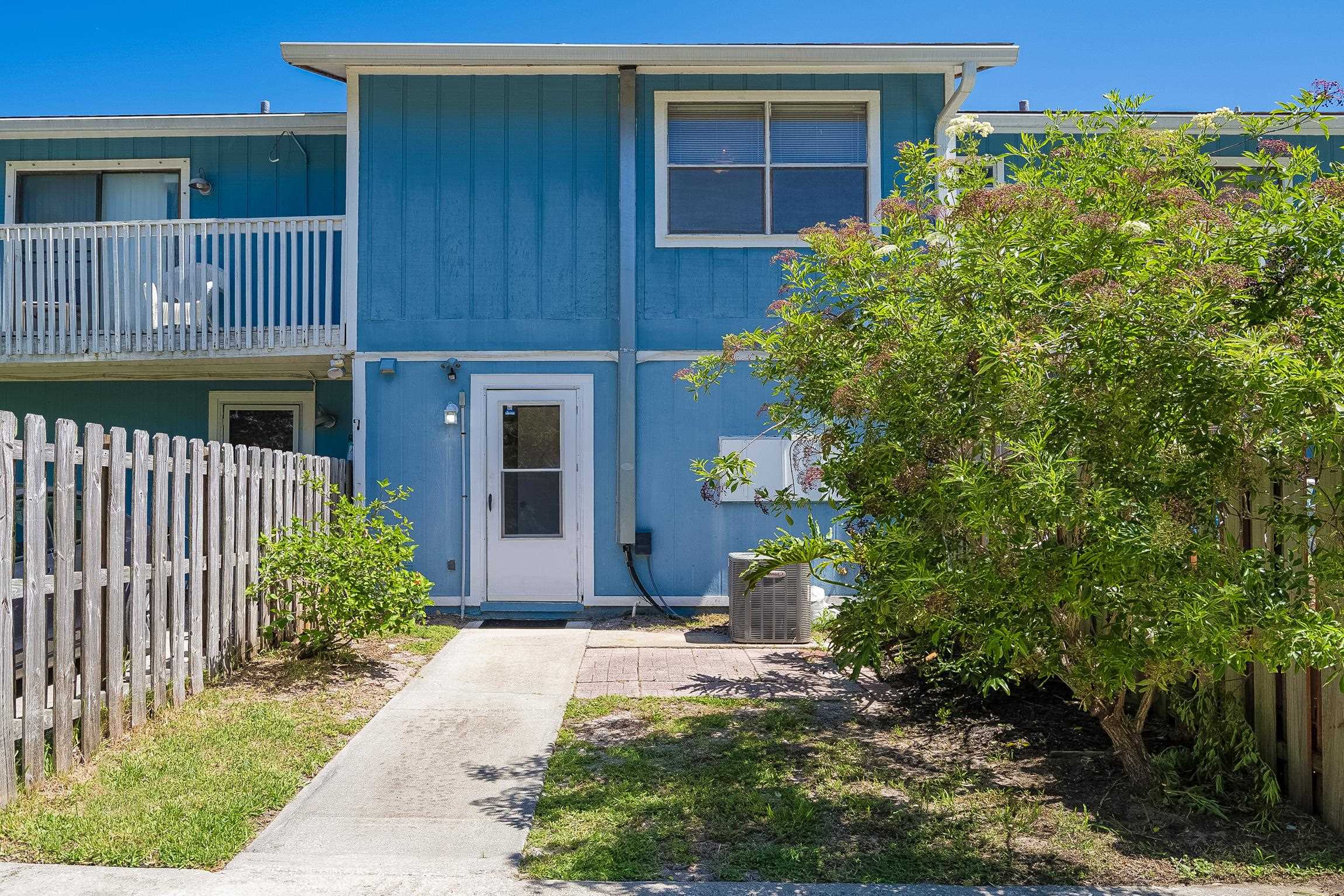 123 Rio Del Mar Street, Unit B St. Augustine, FL 32080 - Photo 43 of 51 a front view of a house with a yard