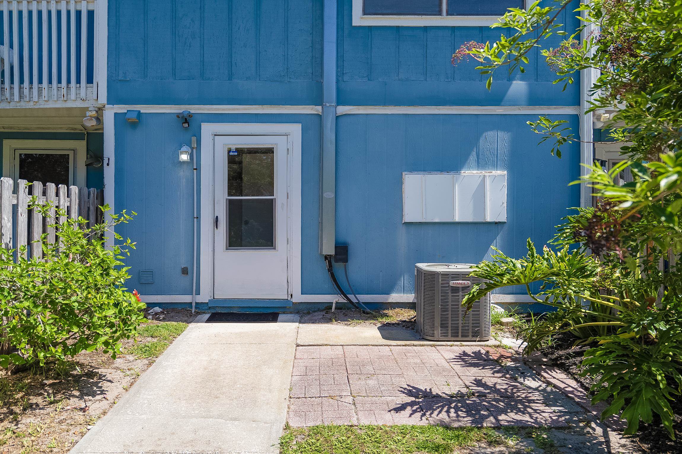 123 Rio Del Mar Street, Unit B St. Augustine, FL 32080 - Photo 44 of 51 a front view of a house with garden