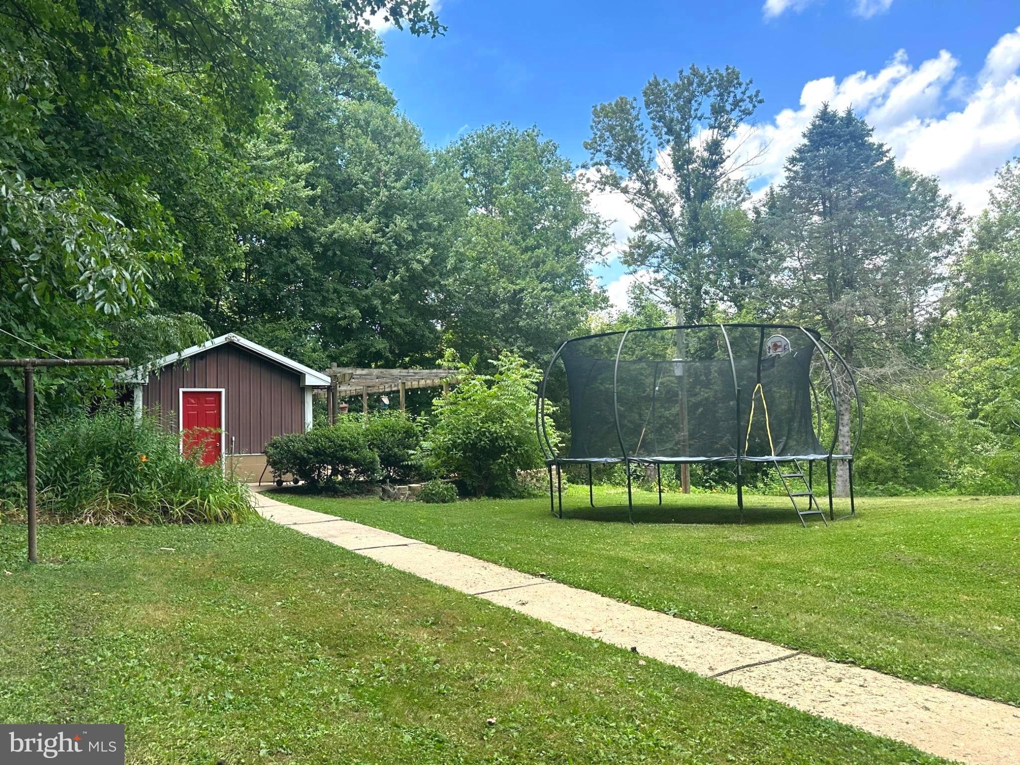 7426 Spring Road Seven Valleys, PA 17360 - Photo 28 of 32 Charming backyard retreat with greenery.
