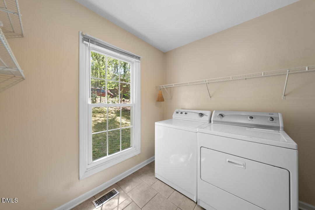 122 Stedwick Place Durham, NC 27712 - Photo 22 of 39 a utility room with dryer and washer