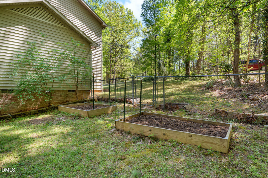 122 Stedwick Place Durham, NC 27712 - Photo 36 of 39 a view of a backyard with a tree