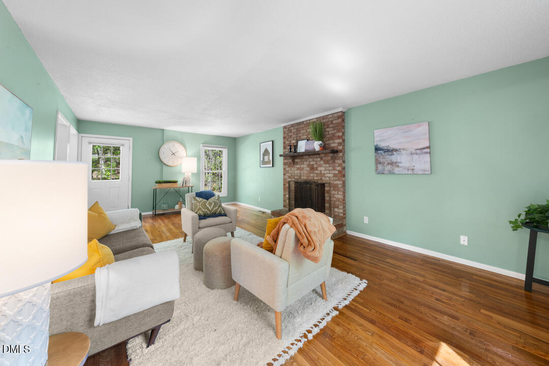 122 Stedwick Place Durham, NC 27712 - Photo 6 of 39 a living room with furniture and a fireplace